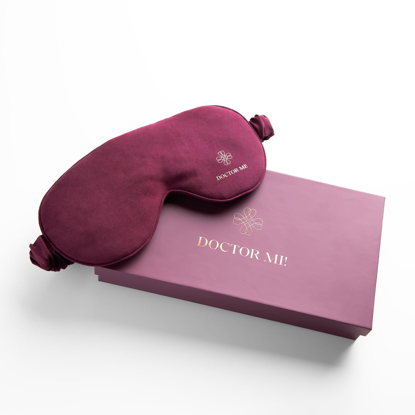 DOCTOR MI! SLEEP MASK hochwertige Schlafmaske für erholsame Nächte als praktischer Reisebegleiter in rotem Material mit roter Box auf grauem Hintergrund